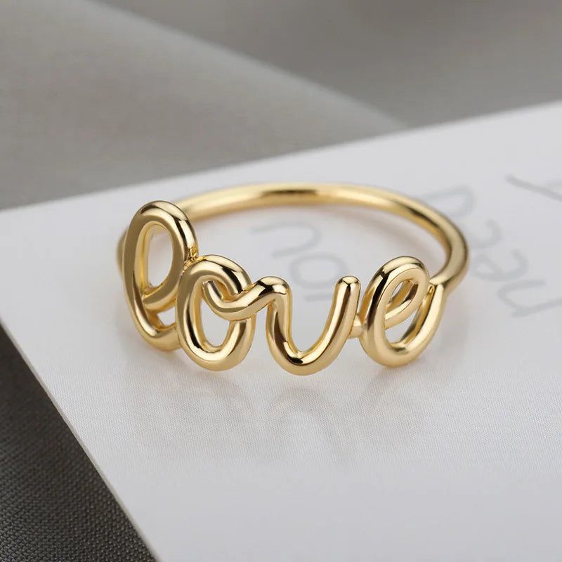 Amora – Gold Stainless Steel "Love" Ring