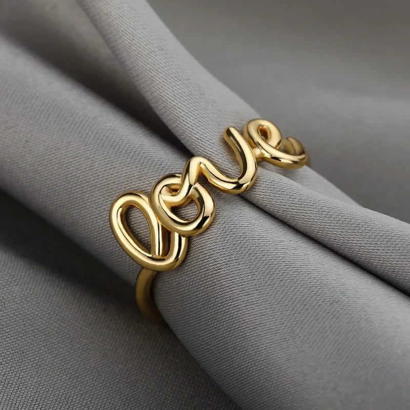 Amora – Gold Stainless Steel "Love" Ring