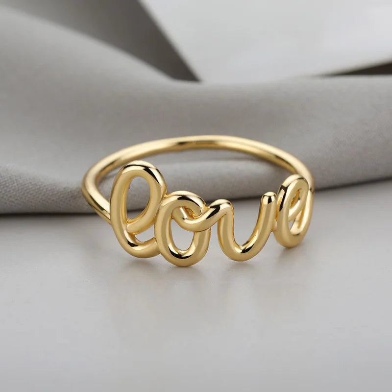 Amora – Gold Stainless Steel "Love" Ring