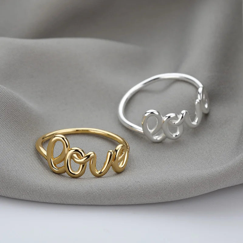 Amora – Gold Stainless Steel "Love" Ring