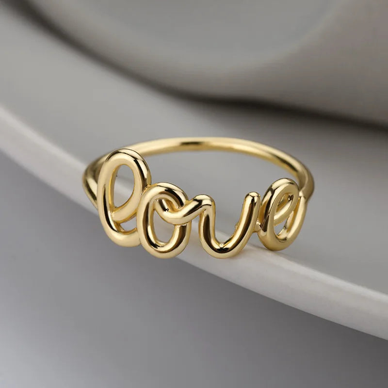 Amora – Gold Stainless Steel "Love" Ring